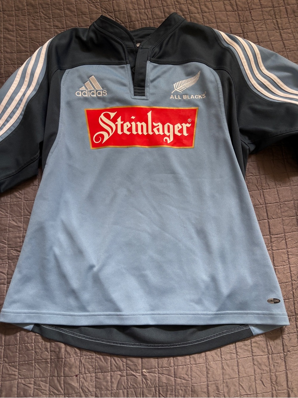 Adidas men’s large All Blacks Light Blue Rugby Shirt with Steinlager Logo